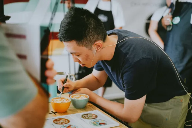 competitor doing latte art