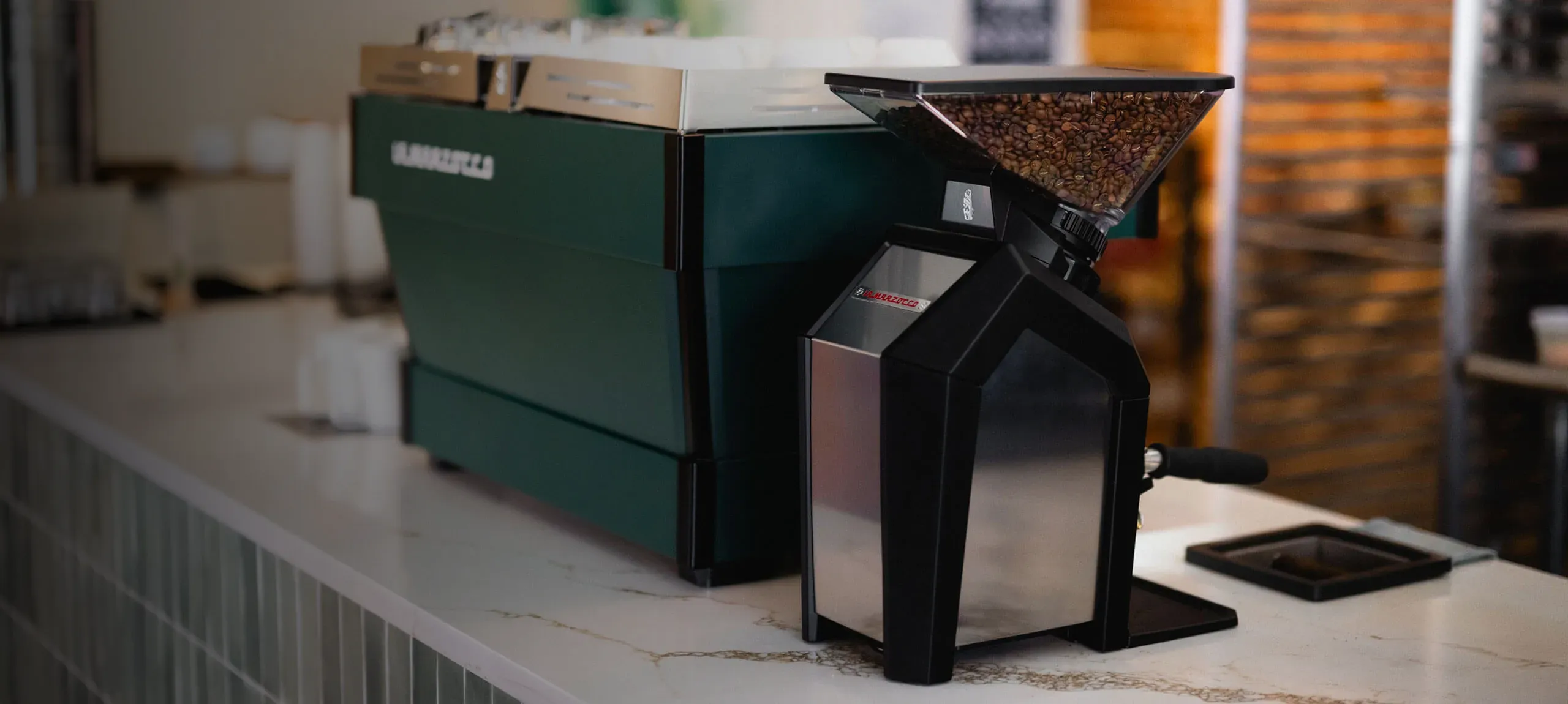 Jay grinder on bench with a Linea PB